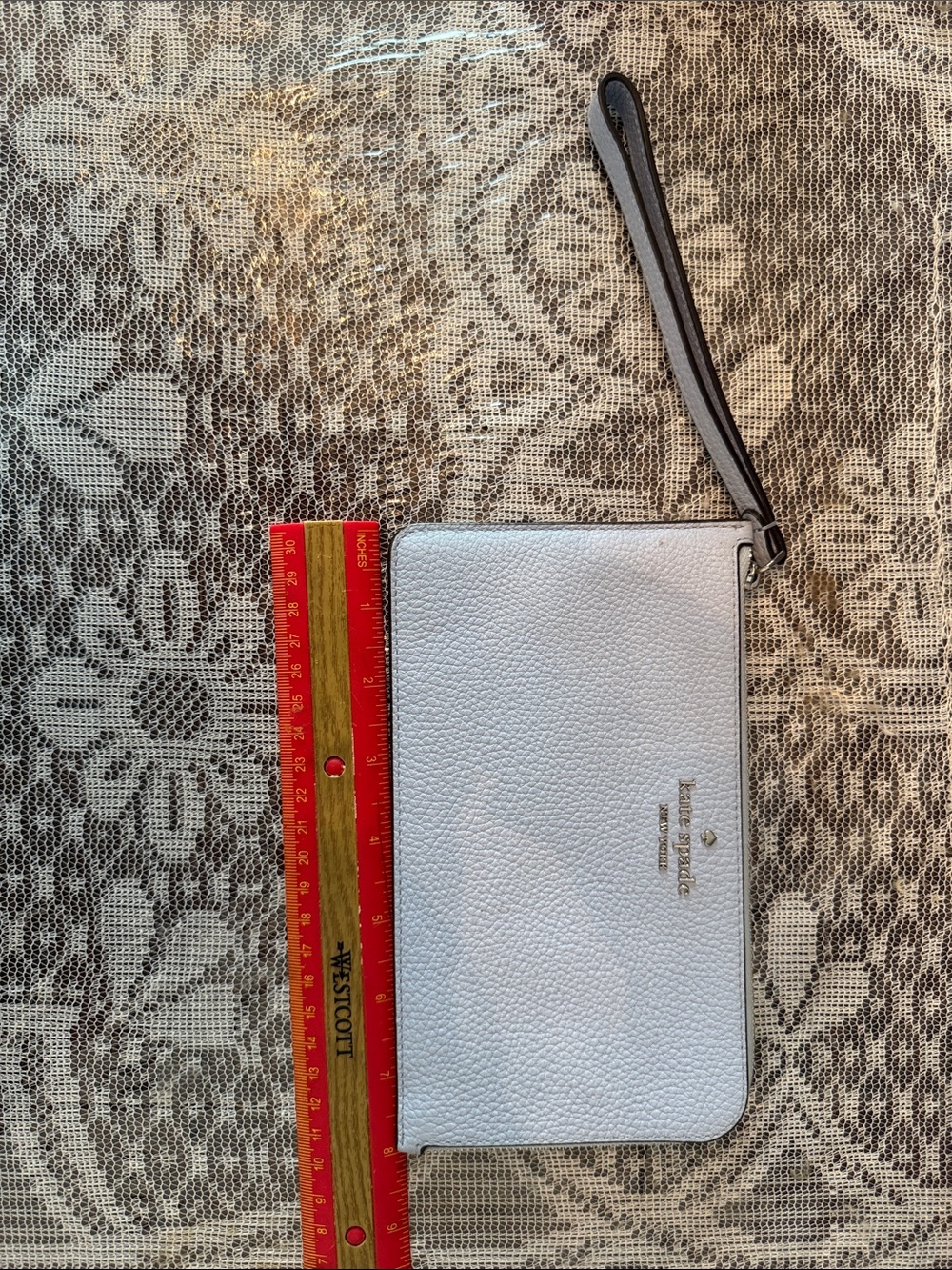 kate spade light blue pebbled leather wristlet with strap